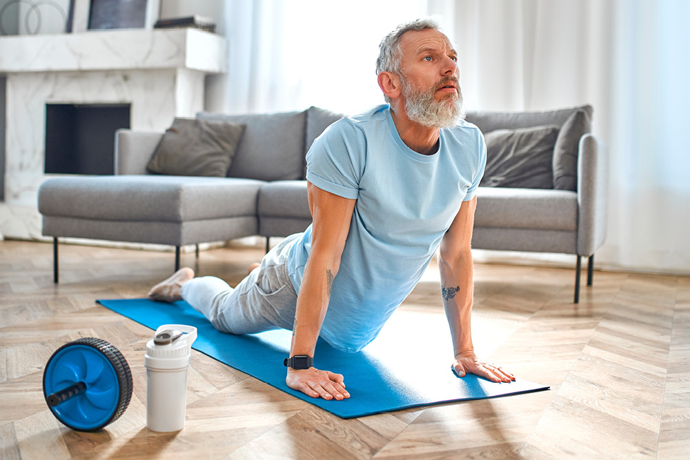 Man doing Pilates at home