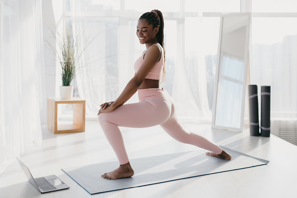 Woman practising Pilates at home